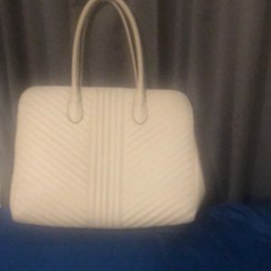 Woman’s light gray large pocketbook